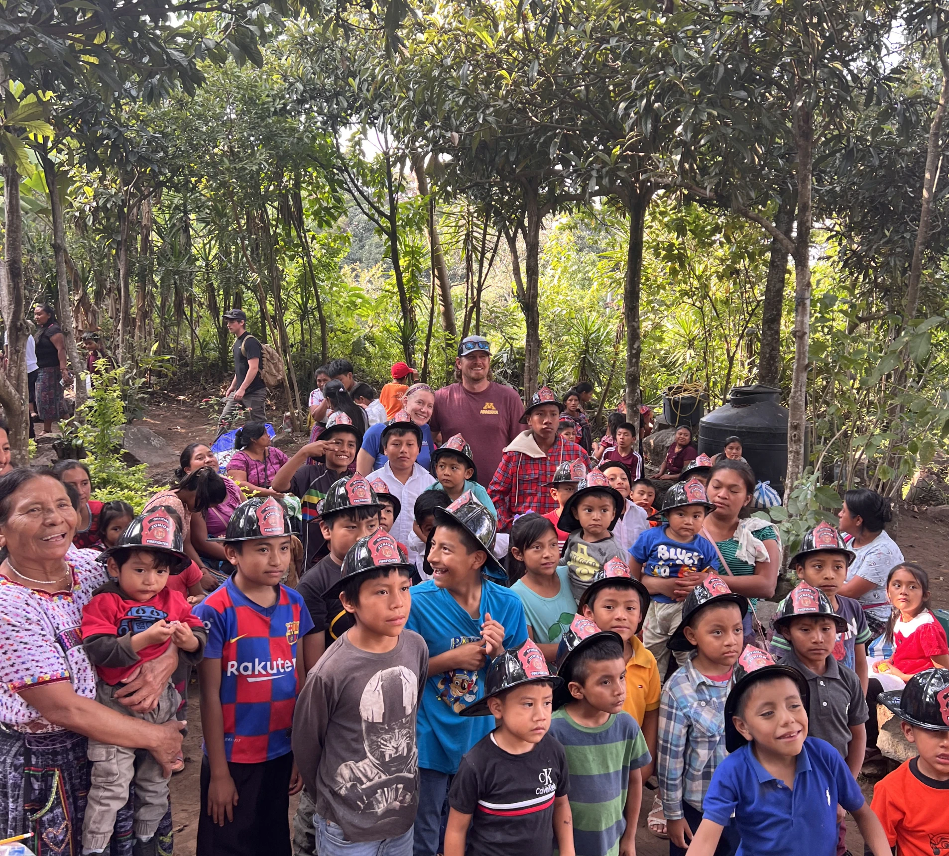 Smiling kids with hats in nature setting